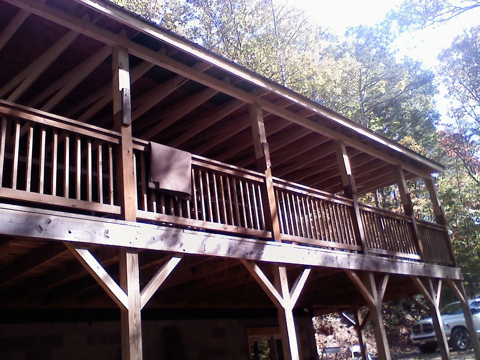 Timber framing under a new elevated porch and deck — Roof Leak Repair in West Palm Beach by Roofing Brothers